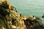 Another photo of fishermen at Tewanam Rock. They're always there.